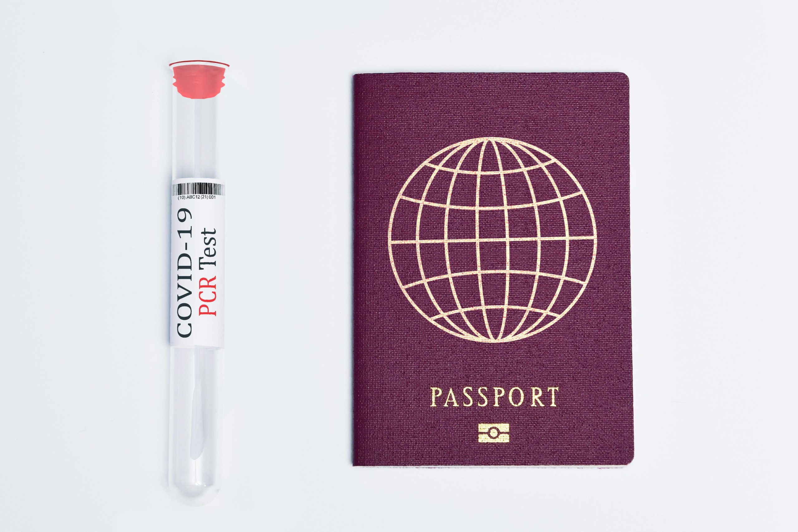 Travel essentials during the pandemic: a COVID-19 PCR test and a passport.